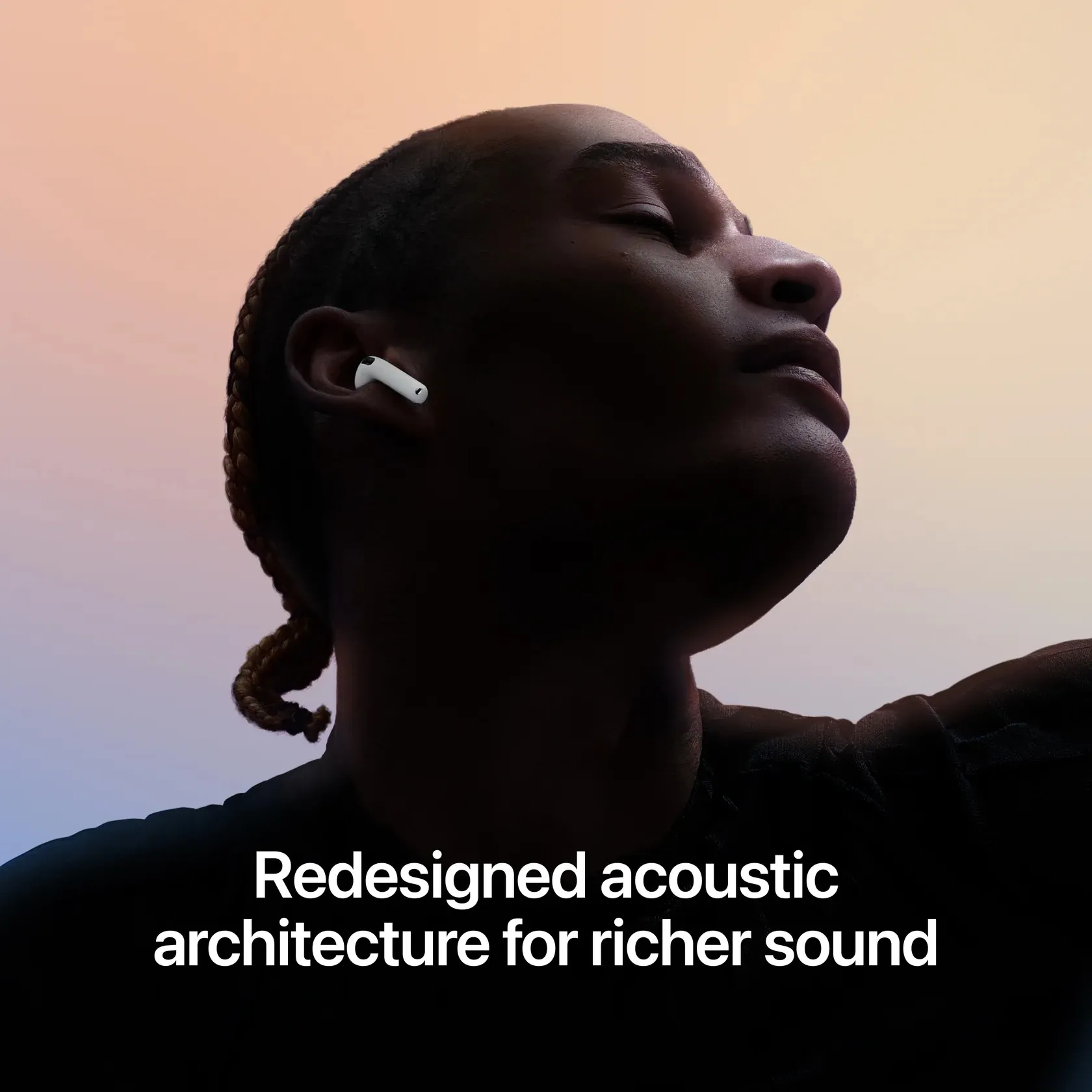 Person wearing AirPods 5 at sunset